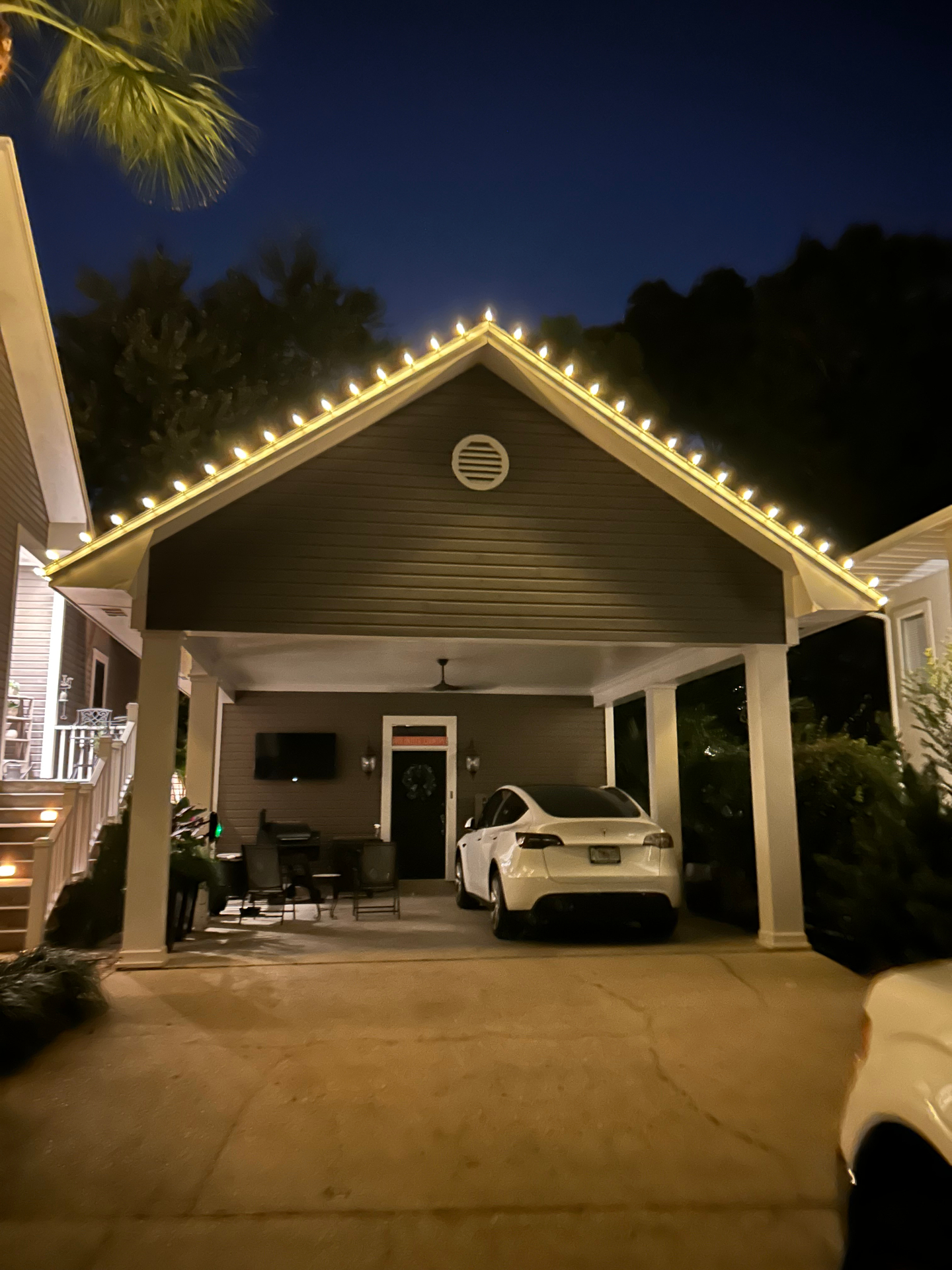 Carport roofline lit with warm white C9 bulbs